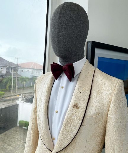 A “Mandarin” dispersed gold ruffle pattern burgundy shawl lapel jacquard suit