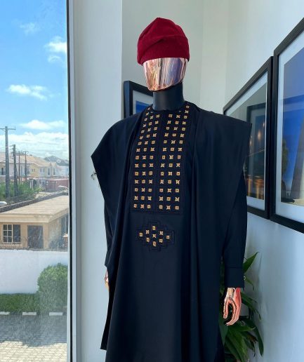 A charcoal black, connected square embroidery design with matching gold and red Swarovski stone details agbada