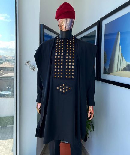 A charcoal black, connected square embroidery design with matching gold and red Swarovski stone details agbada