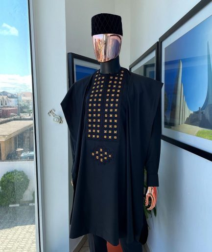 A charcoal black, connected square embroidery design with matching gold and red Swarovski stone details agbada