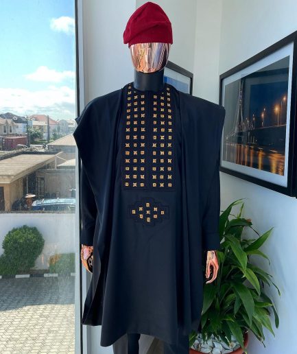 A charcoal black, connected square embroidery design with matching gold and red Swarovski stone details agbada