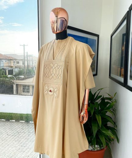 A Tan Brown, connected iron drop embroidery design with matching Agbada