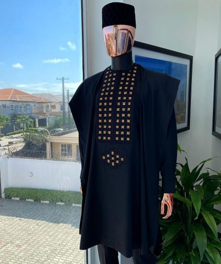 A charcoal black, connected square embroidery design with matching gold and red Swarovski stone details agbada
