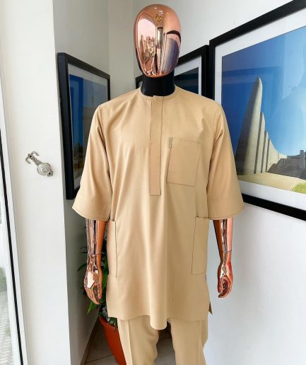 A Tan Brown, connected iron drop embroidery design with matching Agbada