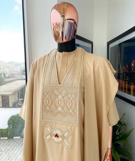A Tan Brown, connected iron drop embroidery design with matching Agbada