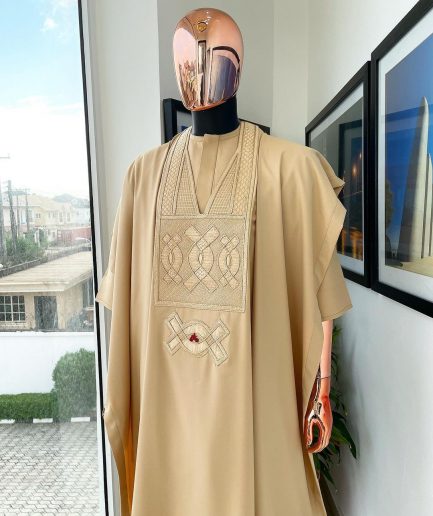 A Tan Brown, connected iron drop embroidery design with matching Agbada