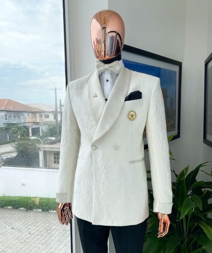 An ivory white Egyptian scritto pattern jacquard shawl lapel single button, double breasted Suit