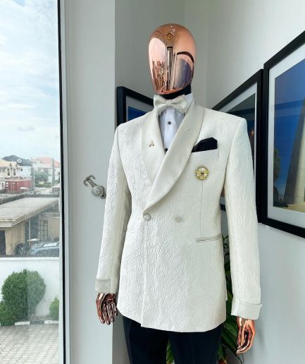 An ivory white Egyptian scritto pattern jacquard shawl lapel single button, double breasted Suit