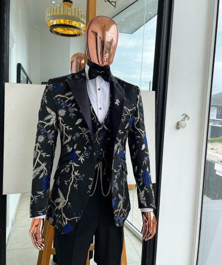 A Gold, black, and blue peak lapel, raven, and forest metallic pattern jacquard Suit