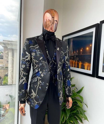 A Gold, black, and blue peak lapel, raven, and forest metallic pattern jacquard dinner suit