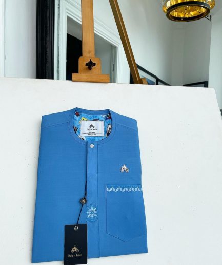 A cerulean blue, vertical Flap with Swarovski button on flap, related embroidery detailing African traditional senator kaftan native.