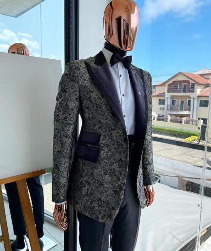 A grey floral jacquard, peak lapel with black silk taping tuxedo suit
