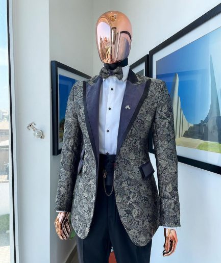 A grey floral jacquard peak lapel with black silk taping tuxedo suit
