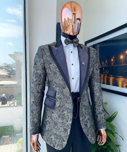 A grey floral jacquard peak lapel with black silk taping tuxedo suit