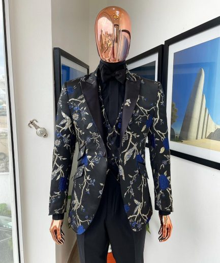 A Gold, black, and blue peak lapel, raven, and forest metallic pattern jacquard dinner suit