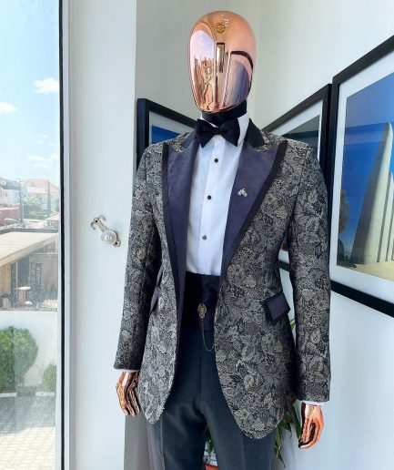 A grey floral jacquard, peak lapel with black silk taping tuxedo suit