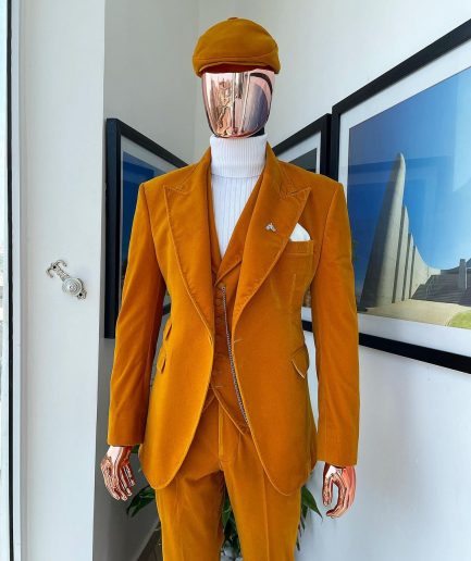 A reloaded monochrome “peaky blinders” hand knitted soaked Italian velvet ochre yellow peak lapel suit