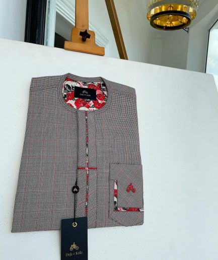 A Dark brown windowpane check, cross-details front flap, and sliding patch pocket African traditional kaftan native