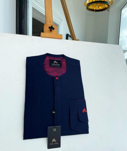 A Midnight blue with paisley detailing, front flap, and a layered patch pocket with a matching Swarovski button African traditional kaftan native