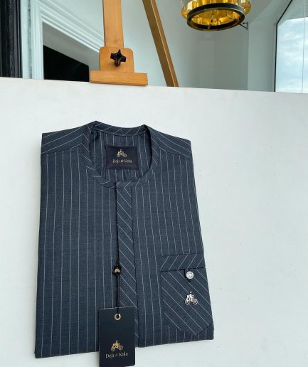 A grey pinstripe kaftan, front Flap with an inverse combat pocket Swarovski button details African traditional senator kaftan native.