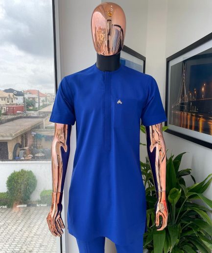 A cobalt blue front flap with a patch pocket details African traditional senator kaftan native