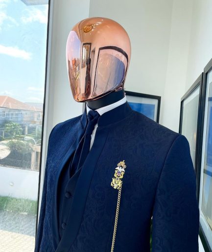 A Reloaded “Pope” navy blue single button bishop neck suit