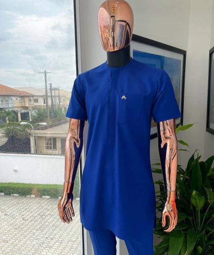 A cobalt blue front flap with a patch pocket details African traditional senator kaftan native