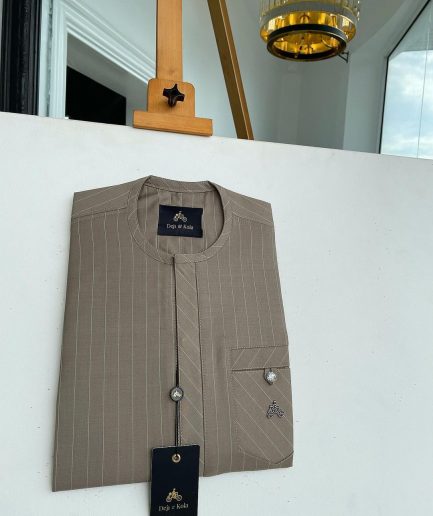 A pencil-striped tortilla brown front flap with an inverse combat pocket Swarovski button details African traditional senator Kaftan native