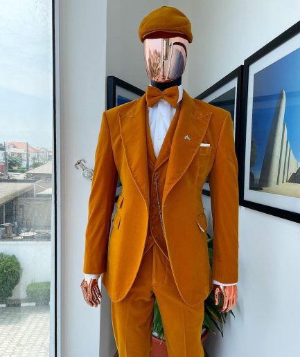 A reloaded monochrome “peaky blinders” hand knitted soaked Italian velvet ochre yellow peak lapel suit