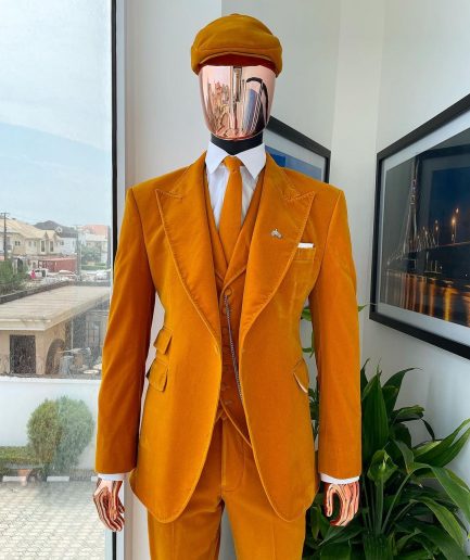 A reloaded monochrome “peaky blinders” hand knitted soaked Italian velvet ochre yellow peak lapel suit