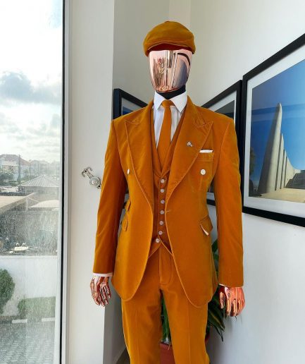 A reloaded monochrome “peaky blinders” hand knitted soaked Italian velvet ochre yellow peak lapel suit