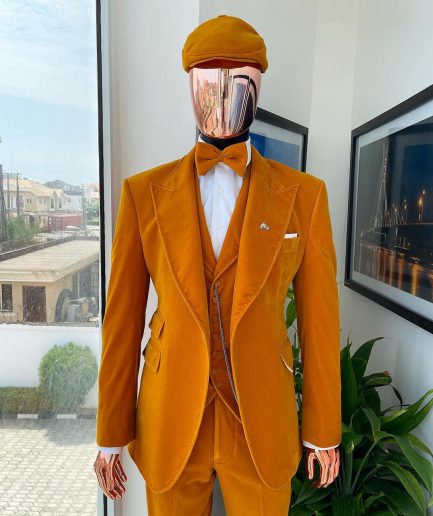 A reloaded monochrome “peaky blinders” hand knitted soaked Italian velvet ochre yellow peak lapel suit