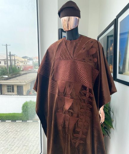 A chocolate brown royal embroidery design agbada, dashiki, hand-knitted matching hat, and Sokoto