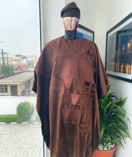 A chocolate brown royal embroidery design agbada, dashiki, hand-knitted matching hat, and Sokoto