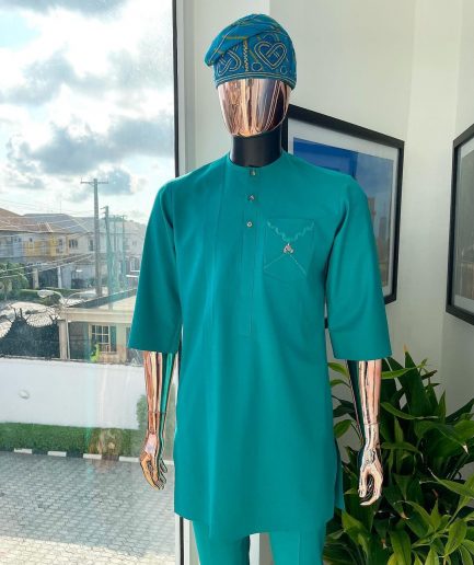 A Jade Green, front flap, valley perspective pocket design and Swarovski button details african traditional kaftan native.