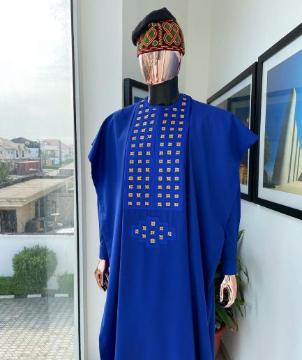 An Azure blue, connected square embroidery design with gold treading & matching Swarovski stone details agbada