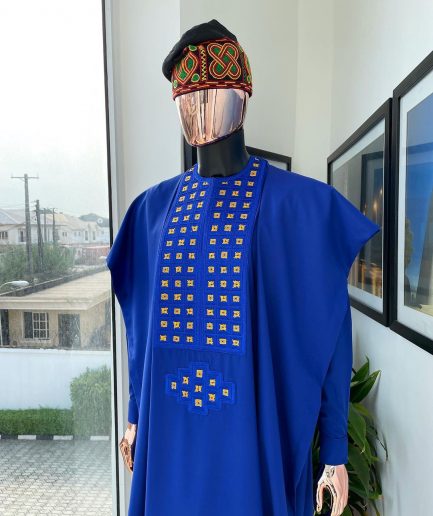 An Azure blue, connected square embroidery design with gold treading & matching Swarovski stone details agbada