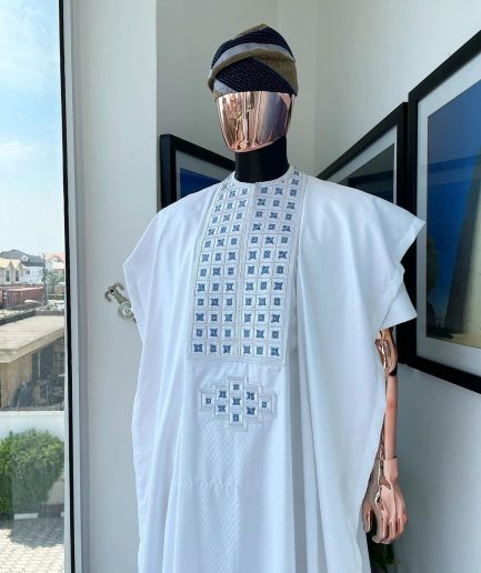 A white, connected square embroidery design with skye blue detailing Swarovski stone details agbada