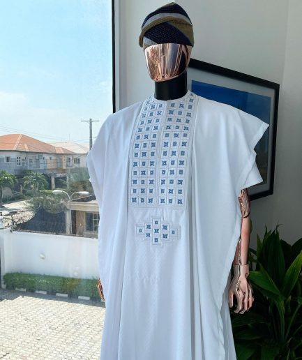 A white, connected square embroidery design with skye blue detailing Swarovski stone details agbada