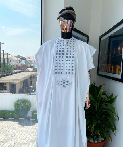 A white, connected square embroidery design with skye blue detailing Swarovski stone details agbada