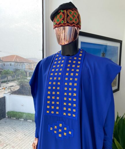 An Azure blue, connected square embroidery design with gold treading & matching Swarovski stone details agbada