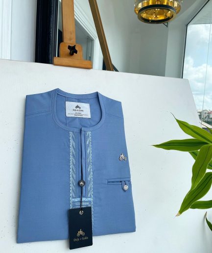 A Maya blue rail line flap with a combat pocket Swarovski button details African traditional senator Kaftan.