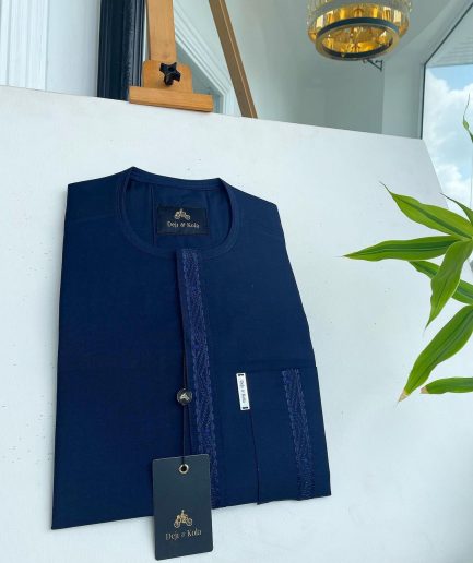 A midnight blue front flap with a line embroidery detail African traditional senator kaftan native