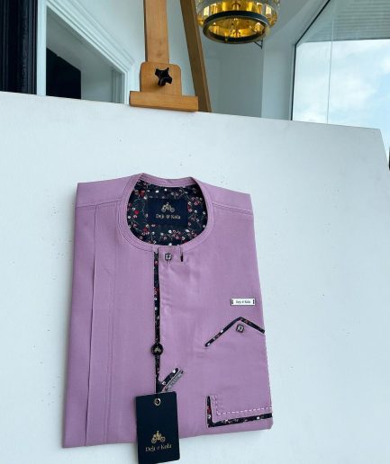 A lavender-purple invisible flap with an invisible pocket, paisley, and Swarovski button details African traditional senator Kaftan native