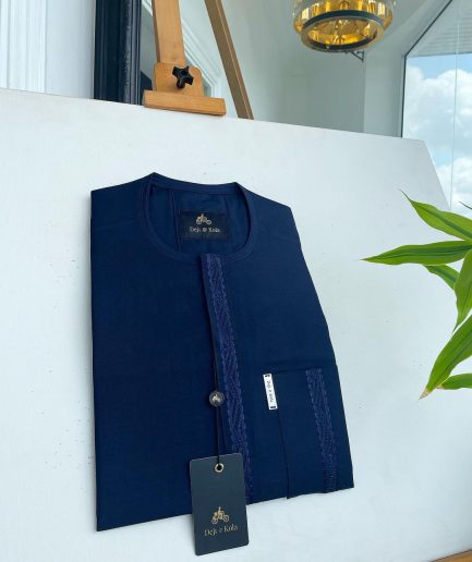 A midnight blue front flap with a line embroidery detail African traditional senator kaftan native