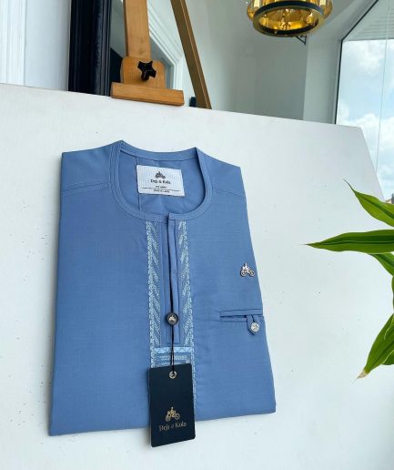 A Maya blue rail line flap with a combat pocket Swarovski button details African traditional senator Kaftan.