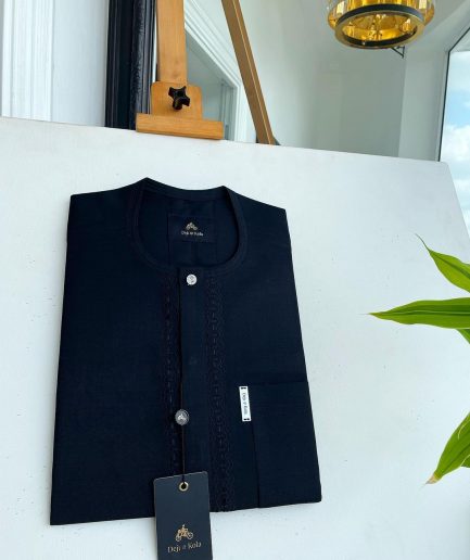 A Charcoal black front flap, interconnected embroidery, and a Swarovski button detail African traditional senator Kaftan native.