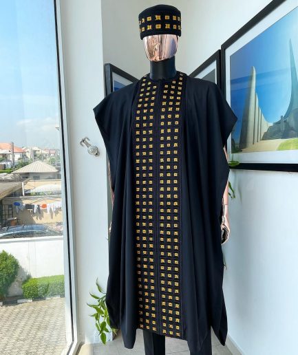 A Reloaded charcoal black, connected square embroidery design with matching gold and red Swarovski stone details agbada