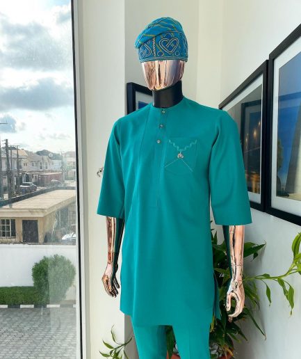A Jade Green, front flap, valley perspective pocket design and Swarovski button details african traditional kaftan native.