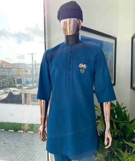 A sapphire blue, front flap, embroidery square rectangle flap and pocket design African traditional senator kaftan native.